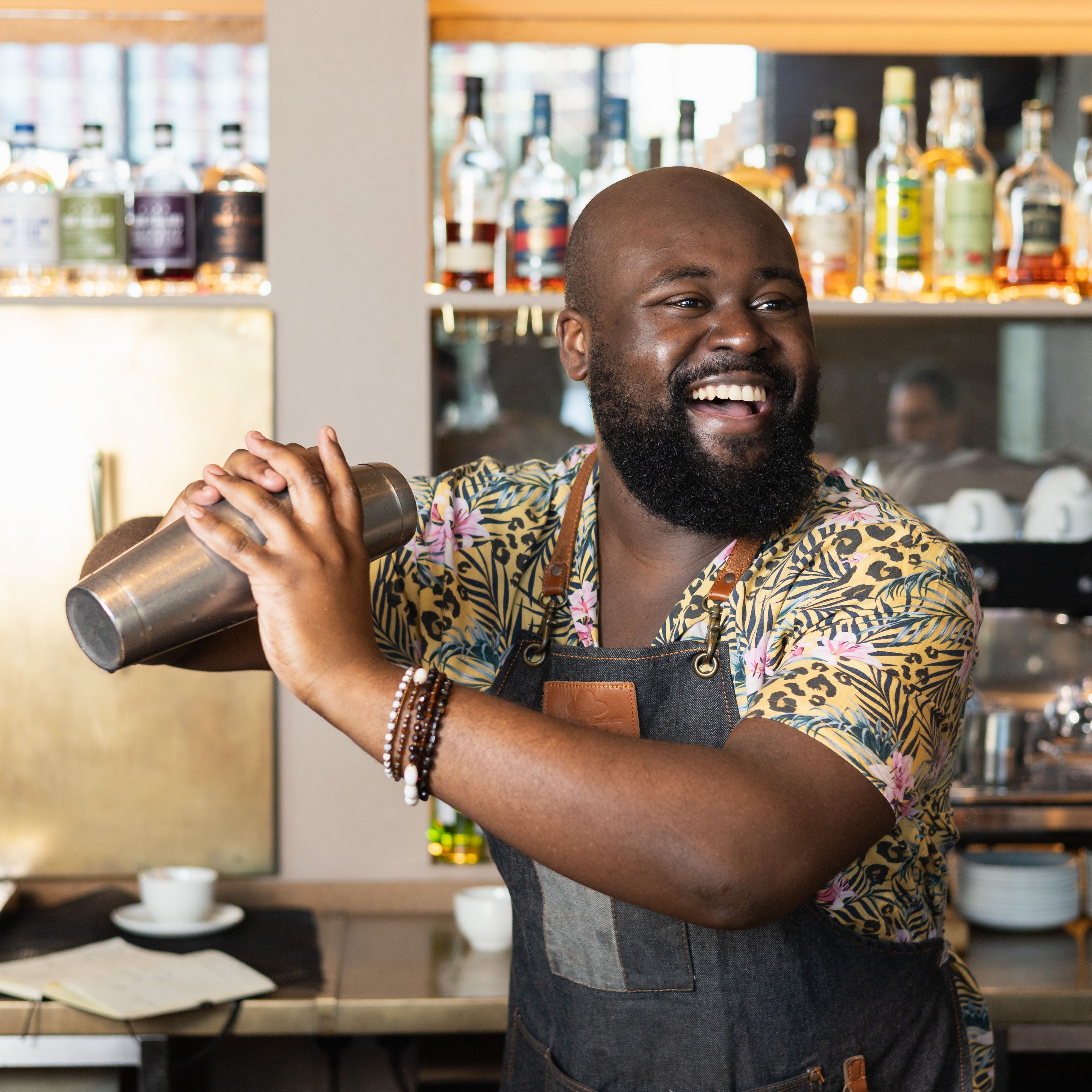 A bartender shaking a cocktail