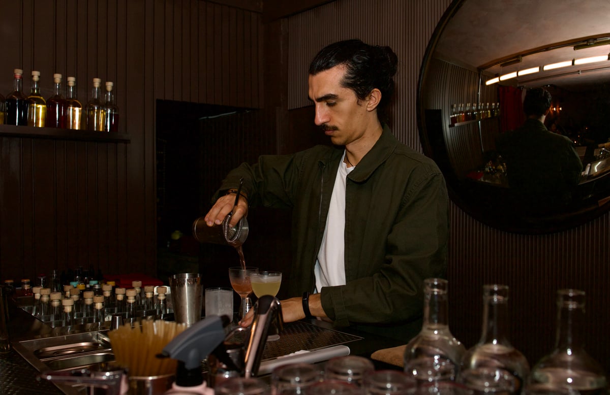 A bartender at cato in Covent Garden making cocktails