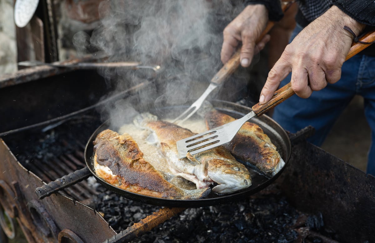 Fresh trout fried over coal
